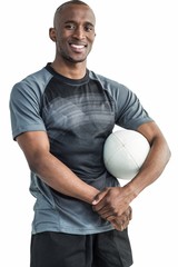 Portrait of happy confident sportsman with rugby ball