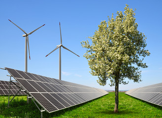 Solar energy panels with wind turbines. The concept of clean energy.