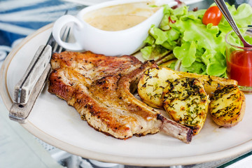 Pork chop with fried potatoes