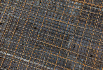 Steel bars reinforcement on construction site, top view, editable background. Formwork used on construction sites for concrete layering.