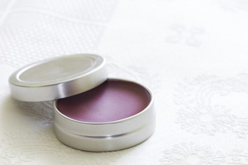 Purple lip balm with beeswax and aroma of redcurrant