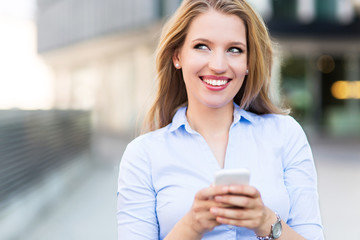 Fototapeta premium Woman using mobile phone