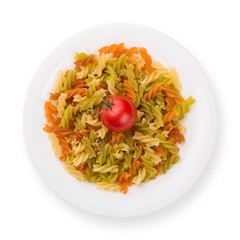 Plate of pasta with tomato from above isolated