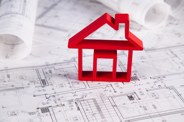 House under construction, blueprints concept