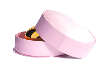 Golden egg in pink gift box