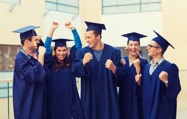 group of smiling students in mortarboards