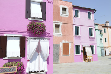One street of the island of Burano (Venice, Italy) with its houses of different colors