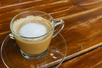hot cappuccino coffee in glass cup