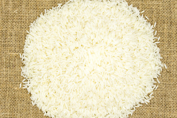 thai raw rice on sack isolated white background