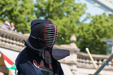 Kendo Fighter in Traditional Clothes with Bamboo Sword