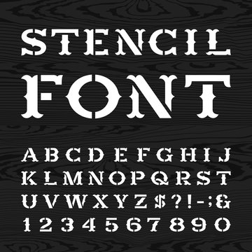 Western style retro alphabet vector stencil font. Serif type dirty letters, numbers and symbols on the dark wood textured background. Vintage vector typography for labels, headlines, posters etc.