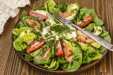Avocado Salad with Romano tomato salmon and poached egg seasoned dressing green oil  