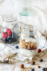 Obraz na płótnie Canvas Granola with yogurt and berries