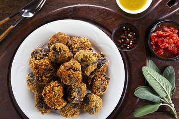 fried eggplant appetizer. vegetarian aubergine balls. with tomat