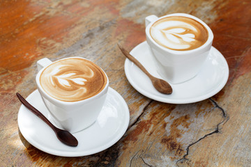 cup of latte coffee on wooden table