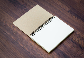 Blank notebook mock up on wood background