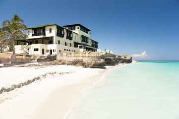 Caribbean resort villa architecture standing above the azure shores of tropical beach in Varadero, Cuba