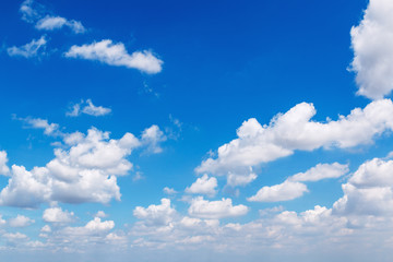 Naklejka na ściany i meble Blue sky with white clouds in a clear day.
