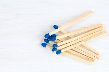 Matches on white wooden background