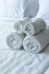 Fototapeta na wymiar white bath towels in bed room, Room service