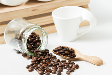 Coffee beans and an old wooden scoop