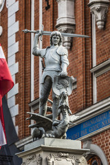 Obraz premium Boy with the sword and dragon; an architectural detail of the Ho