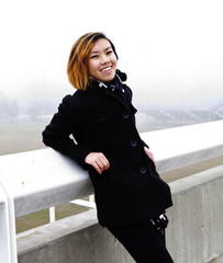 Obraz premium Smiling Skinny Asian American Woman Standing Outdoors
