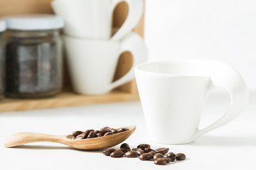 Fototapeta premium Coffee beans and an old wooden scoop