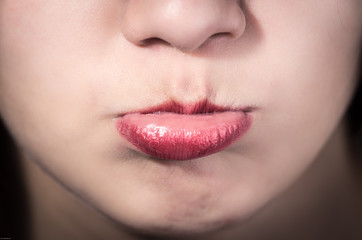 Naklejka premium Closeup of pretty young girl's mouth