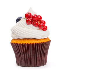 Homemade cupcake with redcurrant on white