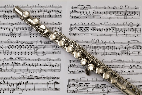 Diagonal flute on flute score music background