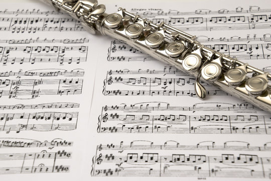 Flute on flute score background
