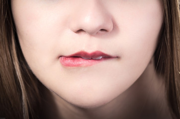 Fototapeta premium Closeup of pretty young girl's mouth