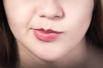 Fototapeta premium Closeup of pretty young girl's mouth