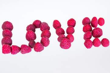Red raspberries on white background