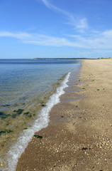 Fototapeta na wymiar Sand beach on Long Island Sound, with blue skies and no people. New York