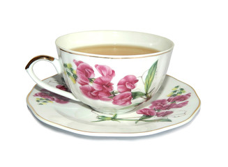 White cup of green tea and saucer with a picture of pink flowers, on white background
