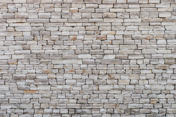 Stone wall made of small limestone bricks