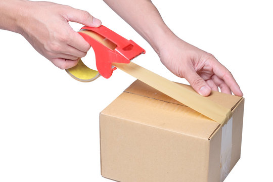 man hand packing box with tape on cardboard box.