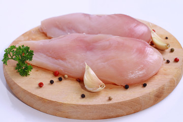 Raw chicken breast fillets  on wooden cutting board. Diet food, healthy lifestyle