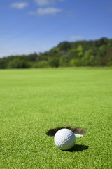 Golf ball close to the hole