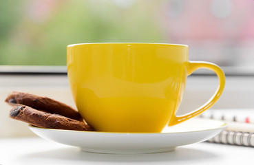 Cup of tea on a window.