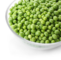 Fresh green peas in bowl isolated on white