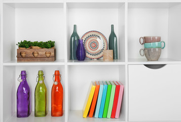 Beautiful white shelves with different home objects