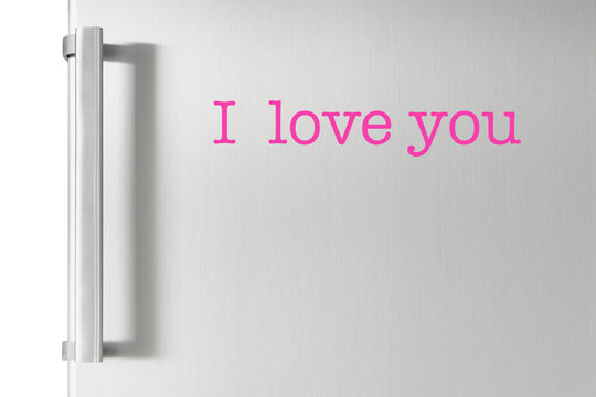 Silver fridge door with handle, with I love you text on it.