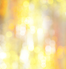Abstract holiday glowing golden background. Christmas holiday glowing abstract glitter defocused...