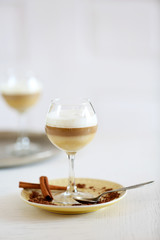 Wine glass with jelly on table, on light background