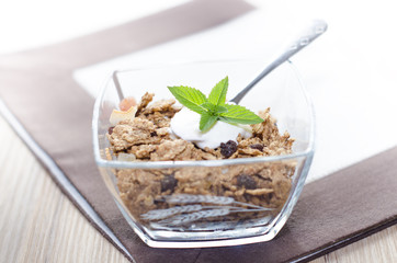 Breakfast on a table with mint and yogurt