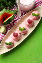 Watermelon ice cream in bowl  on color wooden background