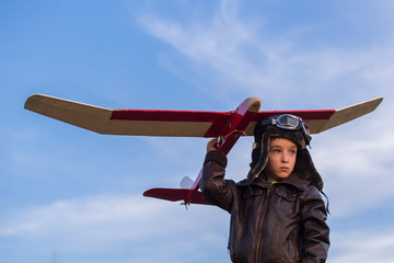 boy with a model airplane field, Young boy-pilot
